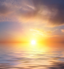 Obraz na płótnie Canvas Fog on a sunset background over the sea.