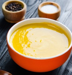 Carrot soup served on the table in bowl