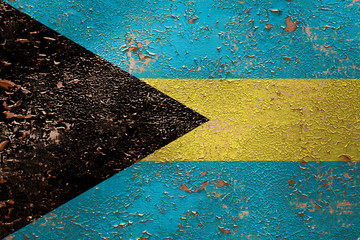 National flag of Bahamas  on old peeling wall background.The concept of national pride and symbol...