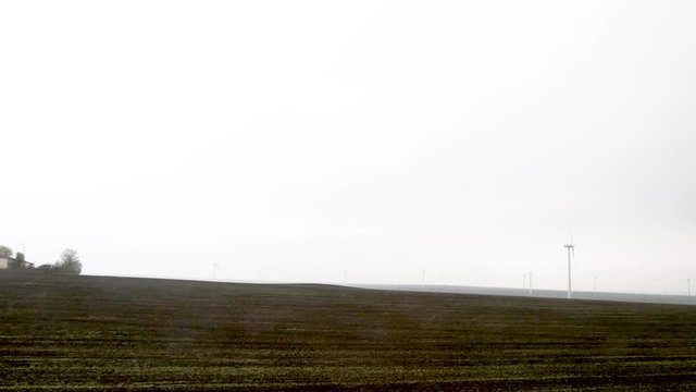 Wind Generators in the Danube Plain, Romania. Sideways motion pictures.