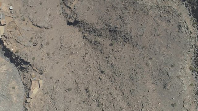 Cinematic drone shot - Revealing shot of a rockey mountain. Abandoned Area.