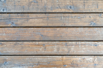 Fototapeta na wymiar Old gray wooden panels. Granary board Peeled wood panels with gaps between them. Background.