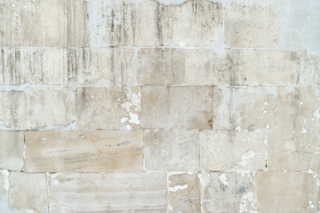 background old gray stone wall polished. repaired seams between stones. Rectangular concrete blocks. Copy space.