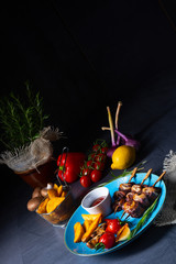 Fototapeta na wymiar cattle shashlik skewers with grilled vegetables on a caucasian
