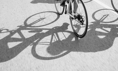 shadow of bike on surface road background, black and white tone