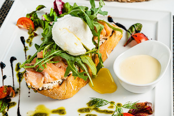 sandwich with salted salmon and poached egg