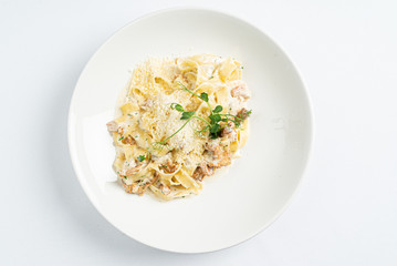 pasta with chanterelles on white plate