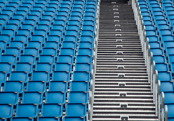 Blue plastic empty stadium  chairs in a row