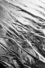 Crumpled silver material as abstract background