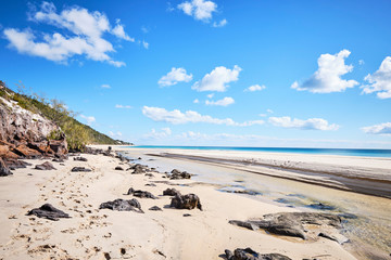 Fototapeta na wymiar White sand dune with people on Fraser Island