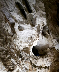 Stalactites in the cave as background