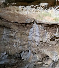 Stalactites in the cave as background