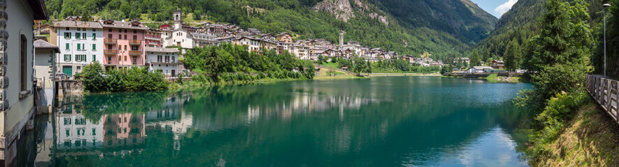 Fototapeta na wymiar Carona. Bergamo, Orobie, Italian Alps, Italy. Landscape at the artificial lake and the village. Summer time