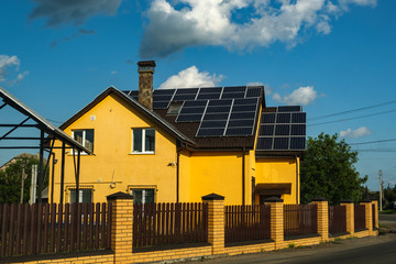 The cottage is equipped with solar panels on the roof. Ukraine.