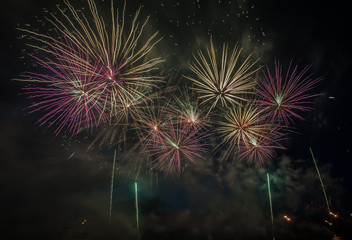 Colorful fireworks close up, fireworks explosion in dark sky. Free space for text. Ventspils city festival. Latvia.