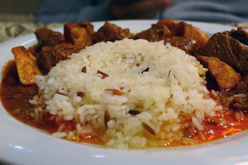 Traditional Oriental Dish with Rise and Meat in a Plate