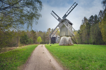 Fototapeta na wymiar old rural wooden mill on the hill