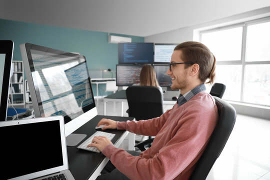 Male programmer working in office