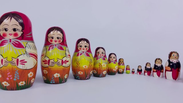 A tracking shot of the Russian Matryoshka Doll on a white background in 4k
