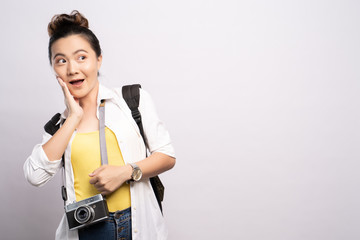 Happy woman holding camera and feel surprise over background