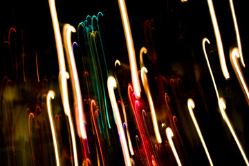 Multicolored lights. Illumination at night in motion. Blurred focus.
