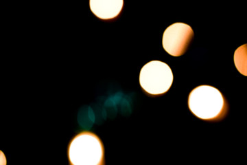 Multicolored lights. Illumination at night in motion. Blurred focus.