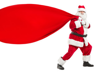 Portrait of Santa Claus pulling big bag on white background