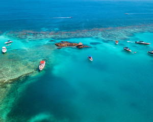 Aerial view small island and boats in the caribbean sea of Colombia