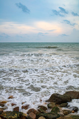 Powerful wave from sea with Rock on the beach before raining storm in Phuket province of Thailand. 