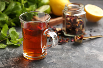 Cup of hot tea on table
