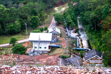 Water pumping stations with big water pipe and canal along the country road in Chiang Mai, Thailand.
