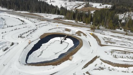 Aerial view Biathlon. Athletes students participating in local competitions. Passage of distance group of athletes in the mountains.