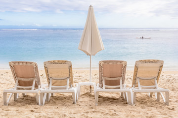 chairs and umbrella on the beach, Réunion Island 