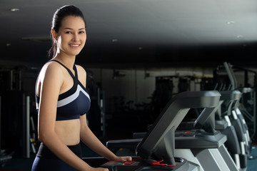 Fototapeta na wymiar Muscular fitness woman exercises healthy lifestyle