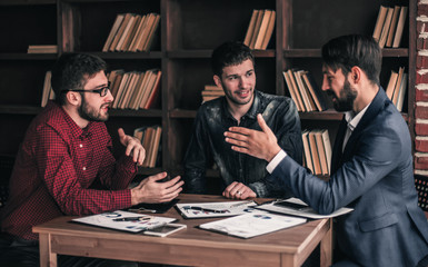 business team makes the analysis of marketing reports at the wor