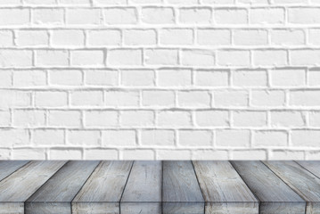 Wooden Shelf or Table in front of clean empty white brick Wall with space for Text or Ideas 
