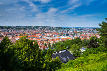 Germany, Wide view over houses, roofs, churches and buildings of stuttgart west in basin on sunny summer day