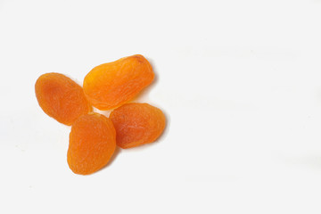 A pile of dried apricots on white background