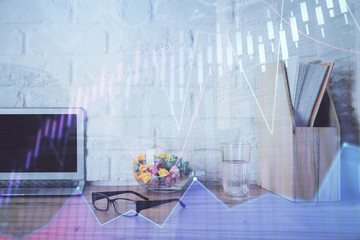 Forex market graph hologram and personal computer on background. Multi exposure. Concept of investment.