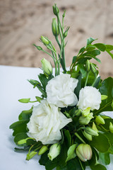 Floral arrangement at a wedding ceremony on beach.