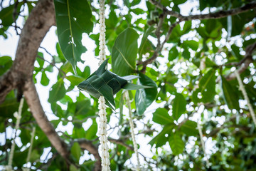 Floral arrangement at a wedding ceremony on beach.
