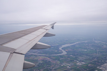Fototapeta na wymiar Landscape from the window view on airplane