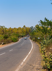  State highway surrounding with trees .