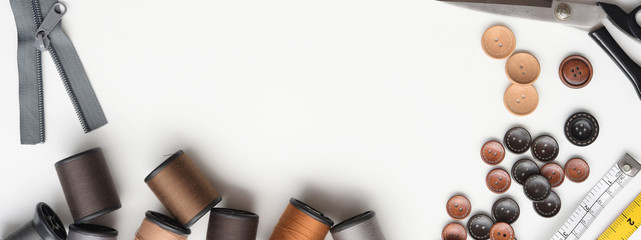 Composition with threads and sewing accessories isolated on white background