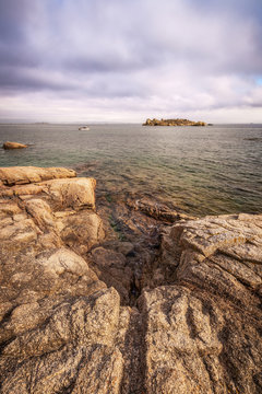 Rock, island and fisherman