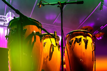 Conga drum instrument with colored background - obrazy, fototapety, plakaty