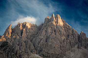 The last rays of the setting sun illuminate the peaks of the Friulian Dolomites, near the Rifugio Giaff, in Friuli, Italy.