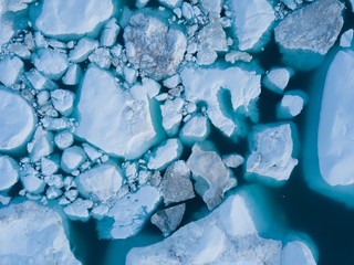 Icebergs drone aerial image top view - Climate Change and Global Warming. Icebergs from melting glacier in icefjord in Ilulissat, Greenland. Arctic nature ice landscape in Unesco World Heritage Site. © Michal