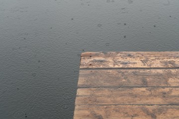 raindrops in water near a flooded object