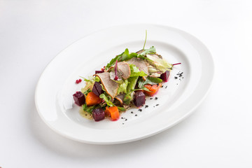 Salad with duck, spicy pumpkin and beetroot isolated on white background